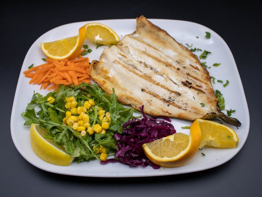 Bronzini over charcoal