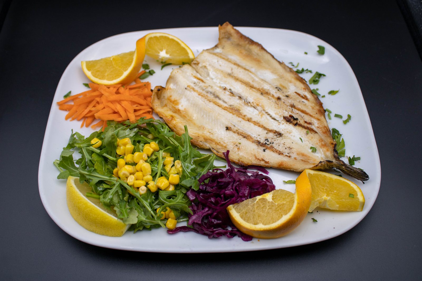 Bronzini over charcoal